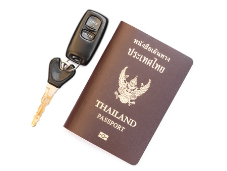 Thailand passport with car key on whiteの写真素材
