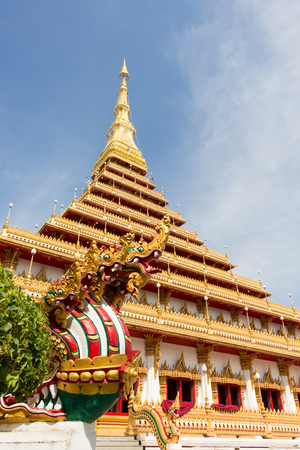 king of nagas statue with pagoda in the old templeの写真素材