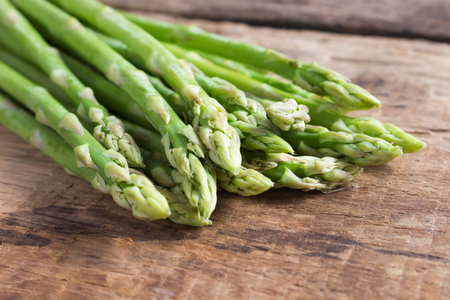 Fresh asparagus on a woodenの写真素材