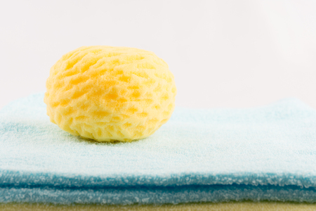 Sponge bath for baby on towel
