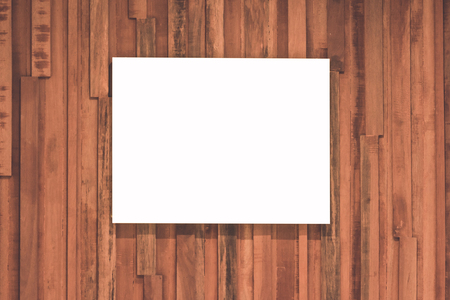 White board on wooden wallの写真素材