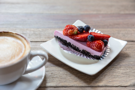 Cheese cake slice with mixed berries toppingの写真素材