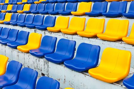 Row of plastic seats at stadium