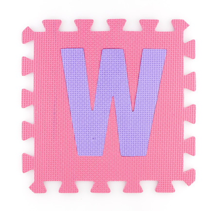 Alphabet puzzle pieces isolated white backgroundの写真素材