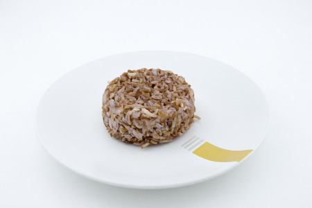 Brown rice isolated on whiteの写真素材