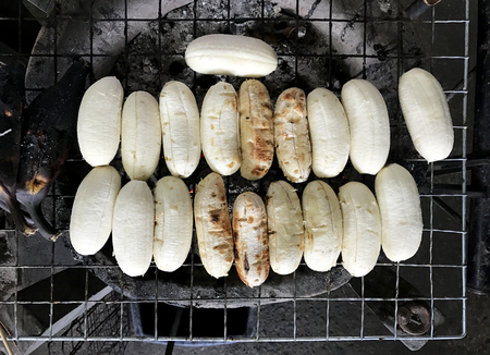 Grilled bananas on rack on stove, dessert in Thailandの写真素材