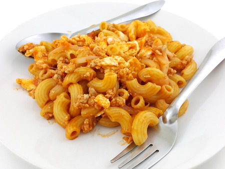 macaroni pasta in tomato sauce with chop meatの写真素材