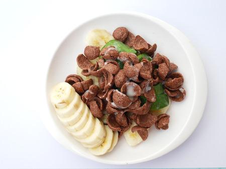 Cereals chocolate with avocado and banana poured sweetened condensed milk