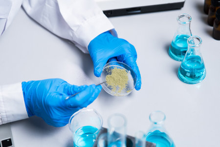 Close-up of scientists researching pathogens to make vaccines, biotechnology studies from bacterial cells in a lab, researchers culture in petri dishes.の写真素材
