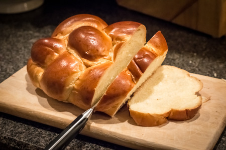 Jewish Challah bread being cut
