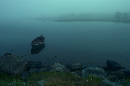 boat moored at the shore misty morningの写真素材