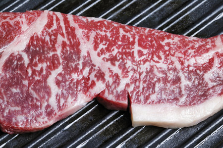 Raw fresh meat on grill, closeup. BBQ party food backgroundの写真素材