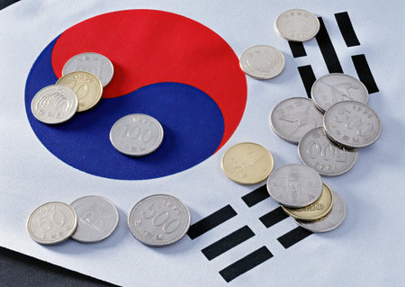 Coins on the flag of South Korea. The concept of saving money.の写真素材