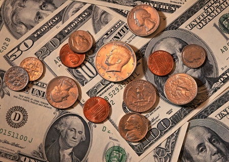 Dollars and coins on the background of the dollar. Business