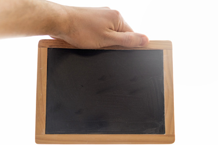 Man hand holding a small blackboard or chalkboard against white background isolated.の写真素材