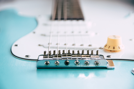 Details and connection of guitar bridge and strings. Close up blue guitarの写真素材