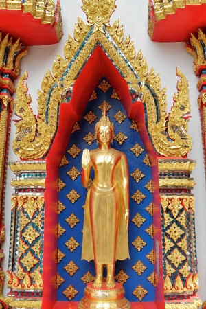 beautiful golden buddha sculpture at thai templeの写真素材