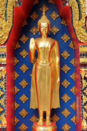beautiful golden buddha sculpture at thai templeの写真素材