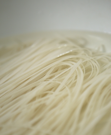 preparation of raw noodle soaked in water before cooking process の写真素材