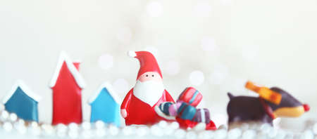 Merry Christmas and Happy New Year. Xmas Festive background. Christmas objects santa clause, gifts boxes, , raindeer, decorative design elements tree and snow. Holiday Greeting card, banner, web poster.の写真素材