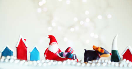 Merry Christmas and Happy New Year. Xmas Festive background. Christmas objects santa clause, gifts boxes, , raindeer, decorative design elements tree and snow. Holiday Greeting card, banner, web poster.の写真素材