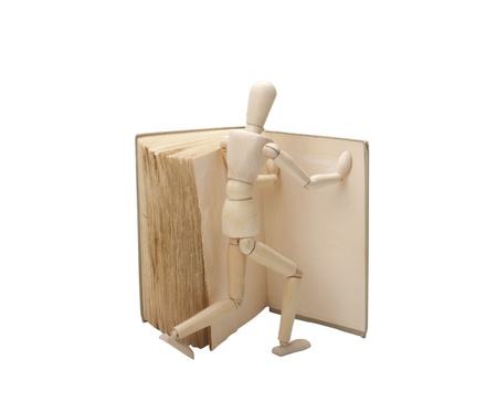 Wooden man and bookの写真素材