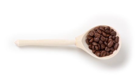 wooden spoon with coffee beans, isolatedの写真素材