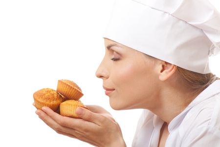 Woman cook holding cakesの写真素材