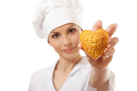 Woman cook holding cakeの写真素材