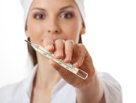 doctor nurse holding thermometer, isolated on whiteの写真素材