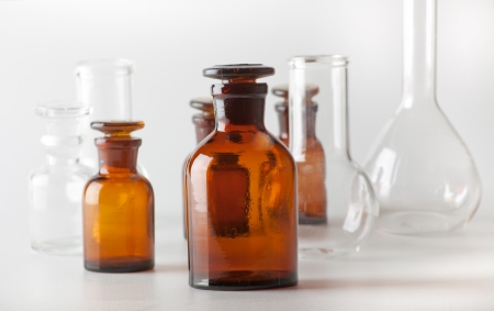 Small chemical glass bottles on white backgroundの写真素材
