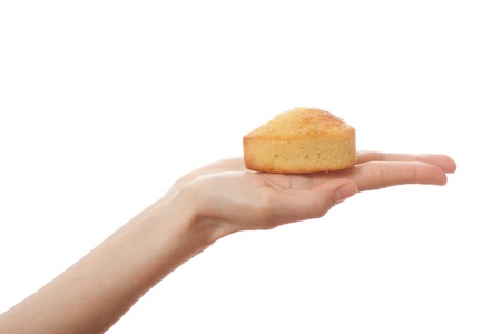 Hand holding cake, isolated on white backgroundの写真素材