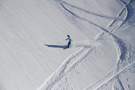 Snowboard freerider  in the mountains