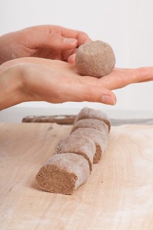 cook hands preparing dough on the table
