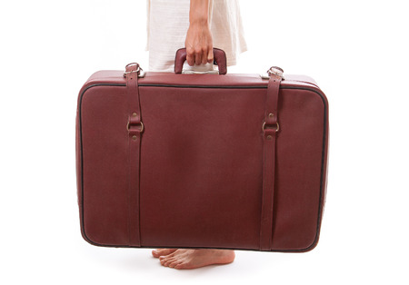  woman holding a vintage suitcaseの写真素材