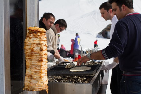 SOCHI, RUSSIA - MARCH 22, 2014: Chefs make Shawarma at the mountain ski resortのeditorial素材