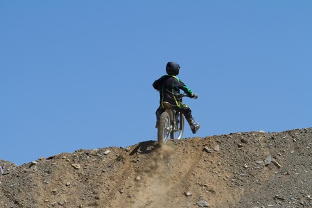 SOCHI, RUSSIA  AUGUST 16, 2014: Off-road motorcycle rider trains in summer mountainsのeditorial素材