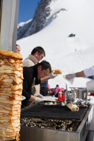 SOCHI, RUSSIA - MARCH 22, 2014: Chefs make Shawarma at the mountain ski resortのeditorial素材