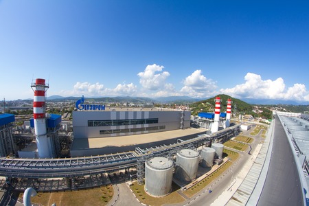 ADLER, RUSSIA - JUNE 26, 2013: Gazprom company logo on the roof of thermal power plant.のeditorial素材