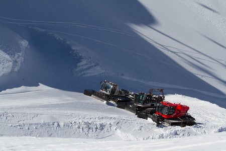 SOCHI, RUSSIA - MARCH 22, 2014: Ratraks, grooming machines, special snow vehicles in ski resort.のeditorial素材