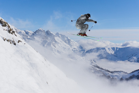 Flying skier on mountains, extreme sportの写真素材