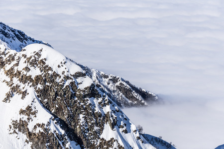 View on mountains and blue sky above clouds, Krasnaya Polyana, Sochi, Russia