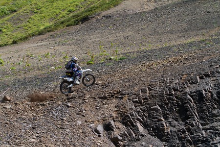 SOCHI, RUSSIA â AUGUST 16, 2014: Off-road motorcycle rider trains in summer mountainsのeditorial素材