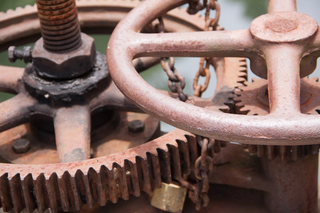 Irrigation Canal and old rusty Floodgate valveの写真素材