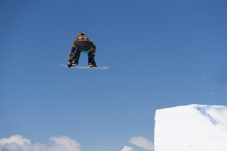 Snowboarder jumps in Snow Park, big air