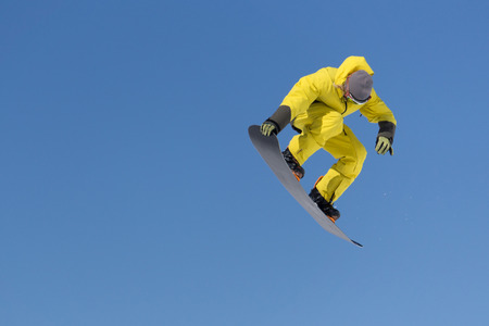 Snowboarder jumps in Snow Park, big air