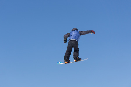 Snowboarder jumps in Snow Park, big air