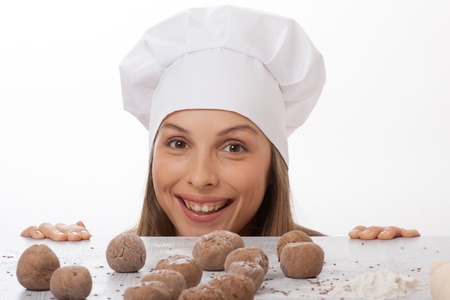 dough balls on the table an woman cookの写真素材