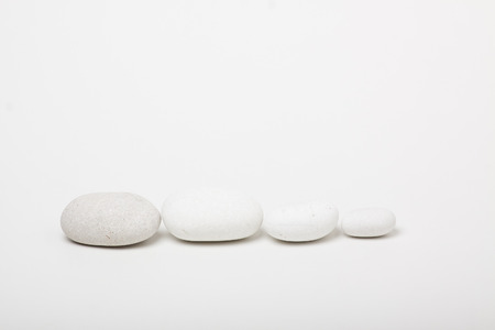 natural white pebbles on white backgroundの写真素材