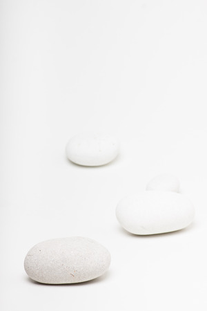 natural white pebbles on white backgroundの写真素材